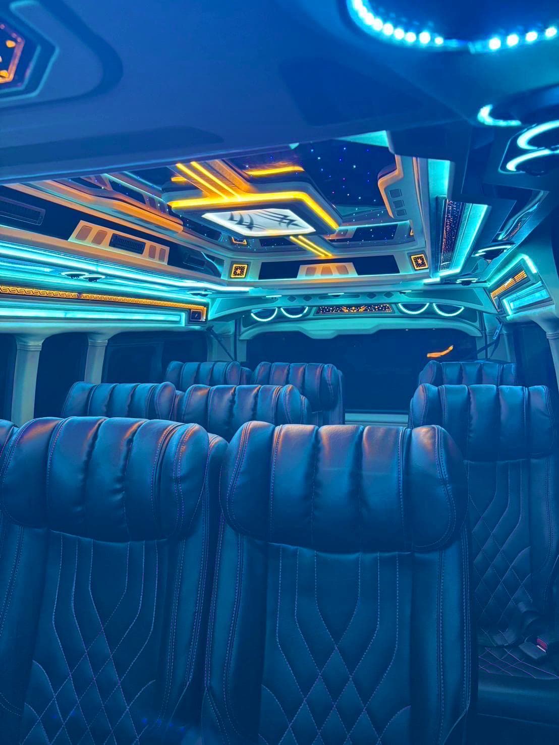 Hua Hin to Pattaya Hotel Transfers Luxury tour bus interior with blue leather seats and neon ceiling lights